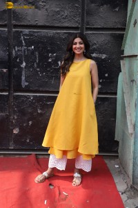 Shilpa Shetty in a yellow salwar kameez dress