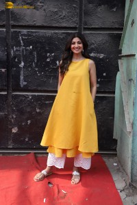 Shilpa Shetty in a yellow salwar kameez dress