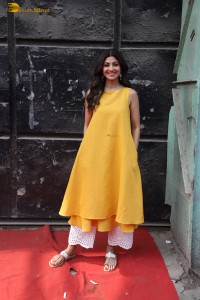 Shilpa Shetty in a yellow salwar kameez dress