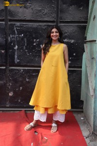Shilpa Shetty in a yellow salwar kameez dress