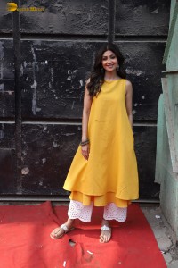 Shilpa Shetty in a yellow salwar kameez dress