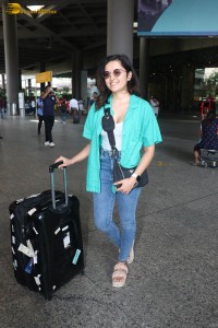 singer and actress shirley setia in a green shirt and denim jeans at airport