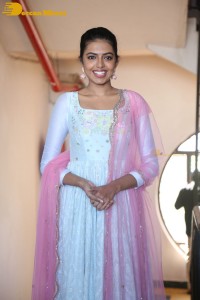 Shivani Rajashekar poses in a light colored Salwar Kameez dress