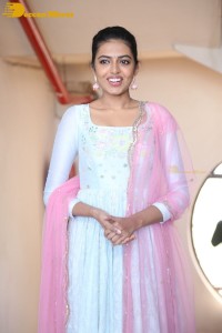 Shivani Rajashekar poses in a light colored Salwar Kameez dress