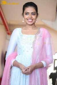 Shivani Rajashekar poses in a light colored Salwar Kameez dress