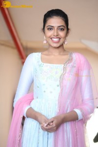Shivani Rajashekar poses in a light colored Salwar Kameez dress