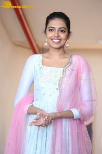Shivani Rajashekar poses in a light colored Salwar Kameez dress