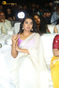Telugu Actress Shivathmika in a white saree at a movie function