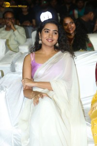 Telugu Actress Shivathmika in a white saree at a movie function