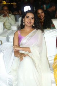 Telugu Actress Shivathmika in a white saree at a movie function