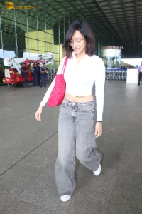 actress Shraddha Kapoor in a white top and grey jeans at airport