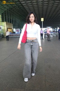 actress Shraddha Kapoor in a white top and grey jeans at airport