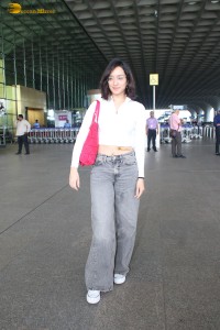 actress Shraddha Kapoor in a white top and grey jeans at airport