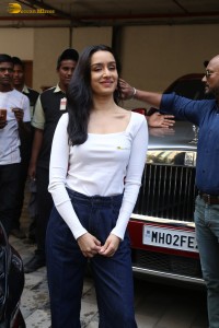 actress Shraddha Kapoor in a white top and jeans looking cute