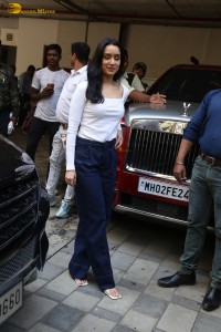 actress Shraddha Kapoor in a white top and jeans looking cute