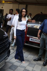actress Shraddha Kapoor in a white top and jeans looking cute