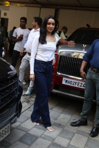 actress Shraddha Kapoor in a white top and jeans looking cute