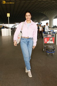 actress Shraddha Kapoor chic look in a pink shirt and denim jeans at airport