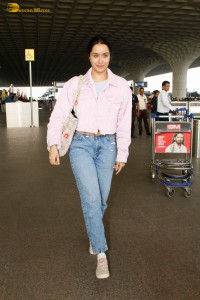 actress Shraddha Kapoor chic look in a pink shirt and denim jeans at airport
