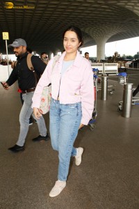 actress Shraddha Kapoor chic look in a pink shirt and denim jeans at airport