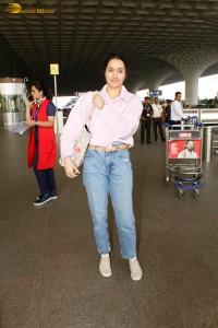 actress Shraddha Kapoor chic look in a pink shirt and denim jeans at airport