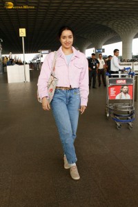 actress Shraddha Kapoor chic look in a pink shirt and denim jeans at airport