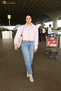 actress Shraddha Kapoor chic look in a pink shirt and denim jeans at airport
