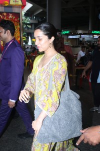 actress Shraddha Kapoor in a yellow salwar at the airport