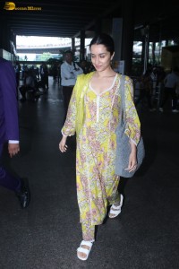 actress Shraddha Kapoor in a yellow salwar at the airport