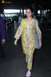 actress Shraddha Kapoor in a yellow salwar at the airport