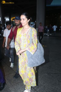 actress Shraddha Kapoor in a yellow salwar at the airport