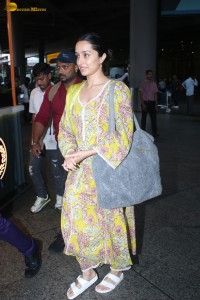 actress Shraddha Kapoor in a yellow salwar at the airport