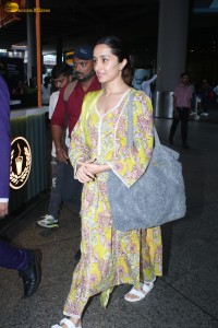 actress Shraddha Kapoor in a yellow salwar at the airport