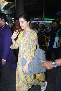 actress Shraddha Kapoor in a yellow salwar at the airport