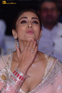 Indian actress shriya saran in a low neck pink dress at function