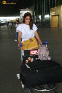 actress shriya saran stylish look in a white dress at the airport