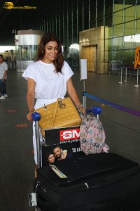 actress shriya saran stylish look in a white dress at the airport