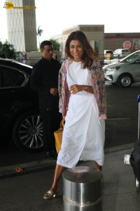 actress shriya saran stylish look in a white dress at the airport