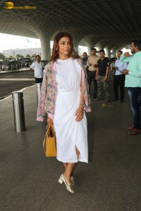 actress shriya saran stylish look in a white dress at the airport