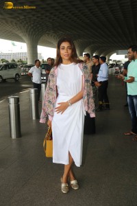 actress shriya saran stylish look in a white dress at the airport