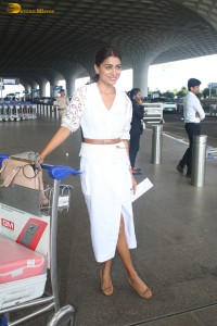actress Shriya Saran stylish looks in a white dress at airport