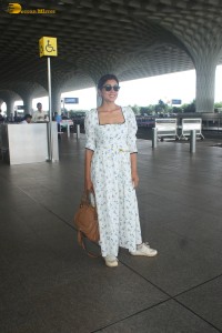 actress Shriya Saran in a white summer dress at mumbai airport