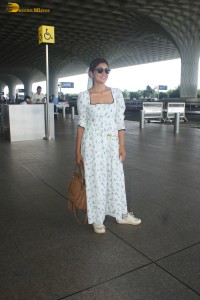 actress Shriya Saran in a white summer dress at mumbai airport