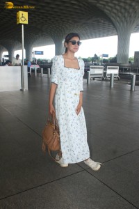 actress Shriya Saran in a white summer dress at mumbai airport