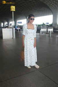actress Shriya Saran in a white summer dress at mumbai airport