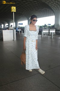 actress Shriya Saran in a white summer dress at mumbai airport