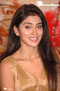 Shriya Saran in a golden color dress promoting her film
