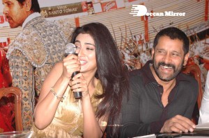 Shriya Saran in a golden color dress promoting her film
