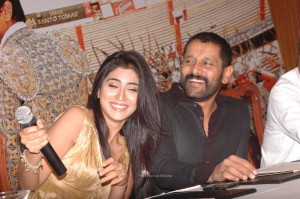 Shriya Saran in a golden color dress promoting her film