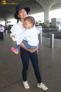 indian actress shriya saran seen with her daughter Radha at mumbai airport
